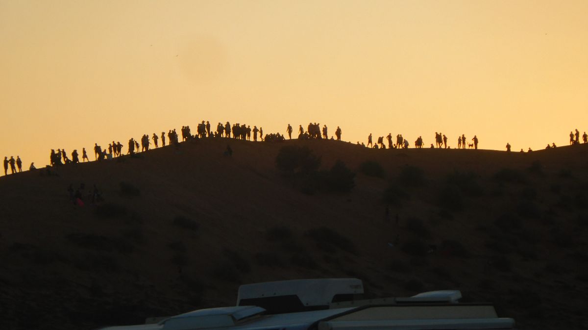 The crowds watch the sunset from Big Red.
