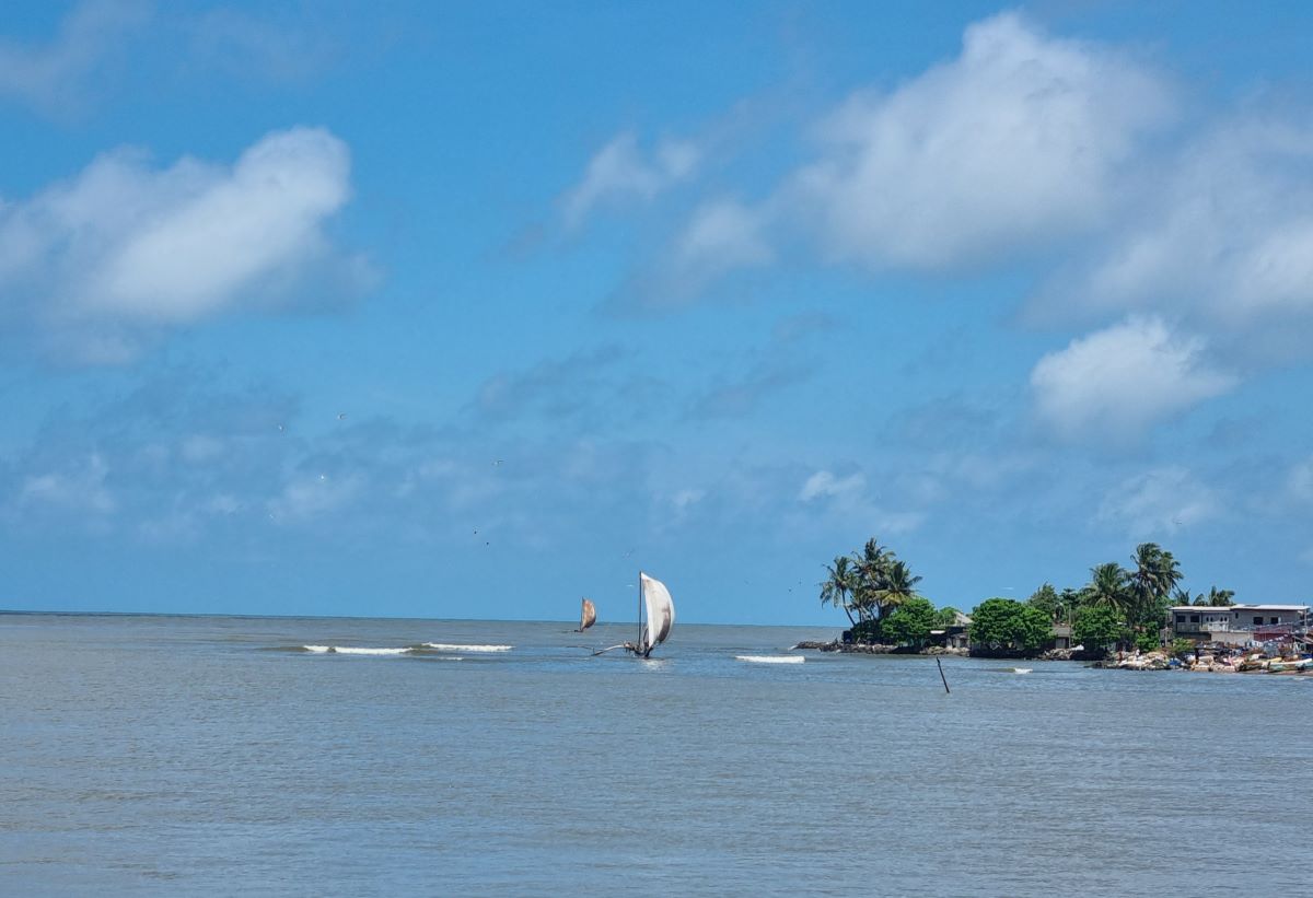 A local fishing boat under sail.